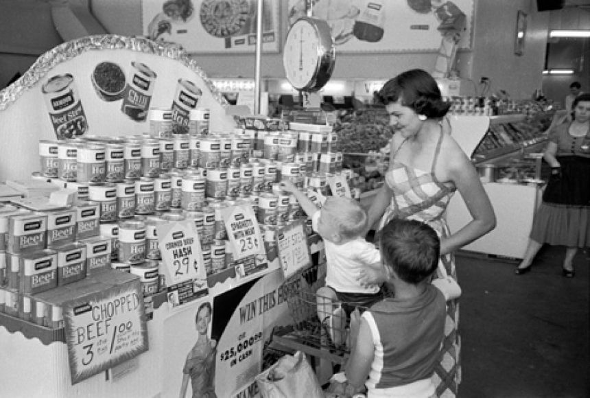 A family shops at a grocery store in El Dorado, AR in 1955